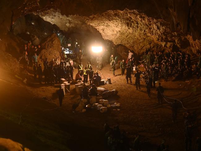 Thai soldiers relaying electric cable deep into the Tham Luang cave during the rescue operation. Picture: AFP