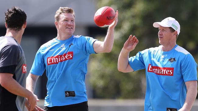 Nathan Buckley, the coach, with assistant coach Scott Burns and skipper Scott Pendlebury (left). Picture: Wayne Ludbey