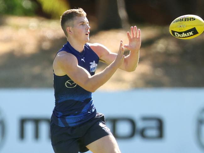 MELBOURNE, AUSTRALIA - MARCH 21: Tom Powell of the Kangaroos in action during a North Melbourne Kangaroos AFL training session at Arden Street Ground on March 21, 2024 in Melbourne, Australia. (Photo by Daniel Pockett/Getty Images)