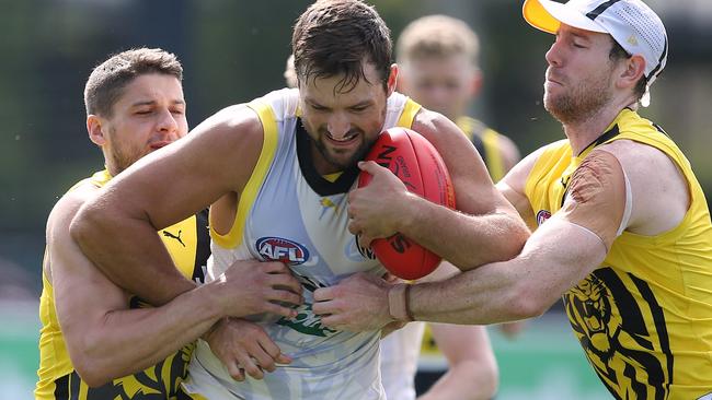 Dion Prestia and Jake Bachelor try to bring down Toby Nankervis. Picture: Wayne Ludbey