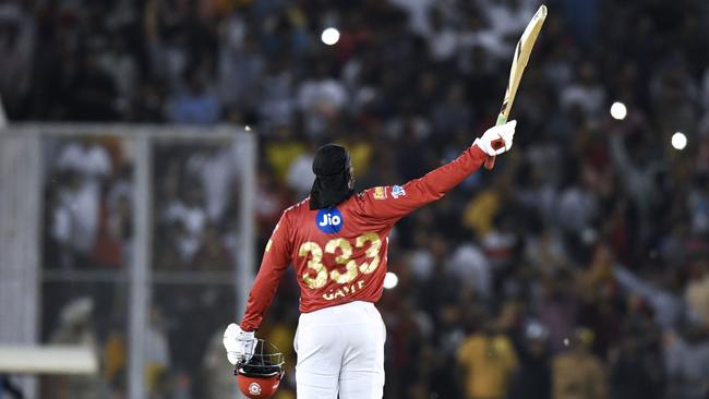 Chris Gayle celebrates his century.