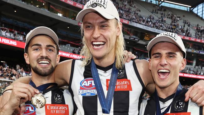 MELBOURNE , AUSTRALIA. September 30, 2023. AFL Grand Final between Collingwood and the Brisbane Lions at the MCG.   Nick Daicos, Darcy Moore and Josh Daicos of the Magpies   .Picture by Michael Klein