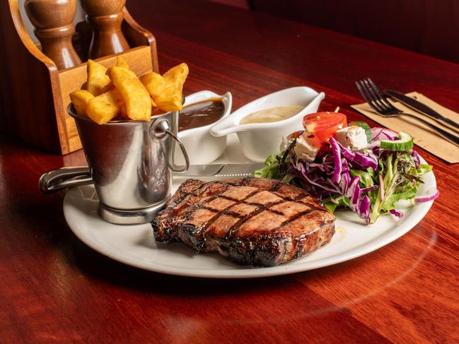 Mr Janetzki’s 300 gram Rib Fillet; with pepper sauce, salad and chips at the Southern Hotel, Toowoomba. Picture: David Martinelli