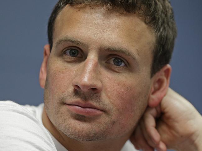 FILE - In this May 12, 2016, file photo, Ryan Lochte listens to a question from the media in Charlotte, N.C. Lochte announced his engagement to former Playboy model Kayla Rae Reid on Instagram, Sunday, Oct. 9, 2016. (AP Photo/Chuck Burton, File)