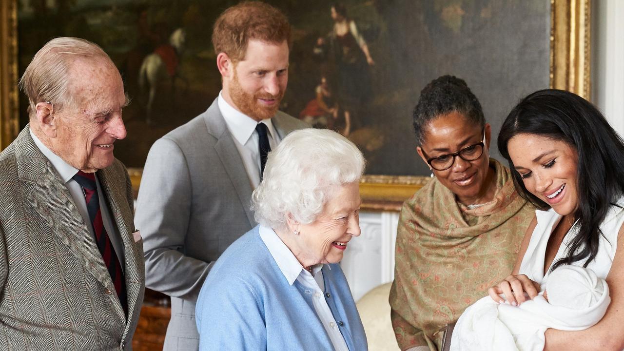 Meghan and Harry showing off a newborn baby Archie to the Queen and Prince Philip, accompanied by Meghan's mother Doria Ragland in 2019. Picture: AFP.