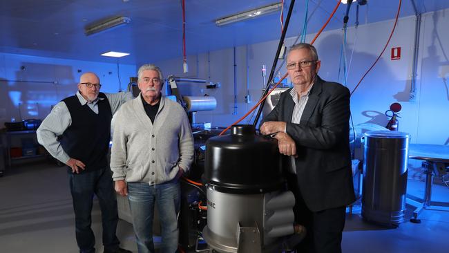 The boss of I Cook Foods, Ian Cook, with retired Detective Sergeant Paul Brady and retired Detective Inspector Rod Porter at the I Cook Foods facility. Picture: Alex Coppel