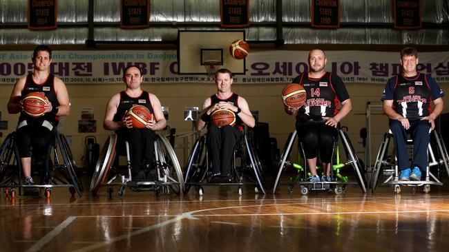 Adelaide Thunder players Adam Roocke, Alex Azevedo, Richard Davis, Phil Stephens and David Gould will attempt a wheelchair basketball world record this weekend. Picture: Stephen Laffer