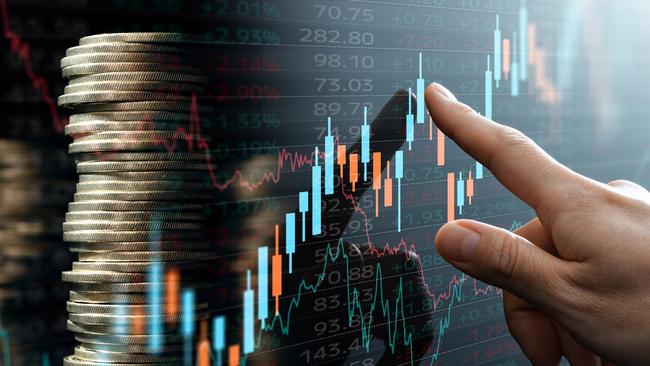 Analyst pointing candlestick chart; investing compound interest generic