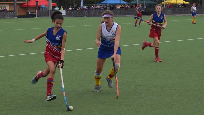 Gympie hosted the 2021 Under 13 Girls State hockey championships over the last four days, with Brisbane teams taking out two of the three division titles. Aryel Bisseling (left) of Brisbane 1 flies down the right hand side. Pictures: Josh Preston