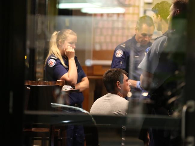 Paramedics at work in the hotel. Pictures: Steve Tyson