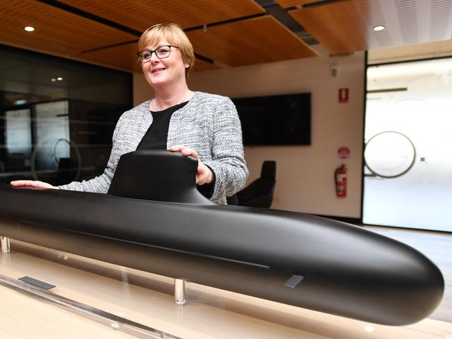 Federal Defence Minister Linda Reynolds poses for a photo  next to a model of the Barracuda-class submarine during a visit to Naval Group in Adelaide, Friday, February 28, 2020. The federal government has vowed to hold a French company to account after it pledged to spend 60 per cent of its $80 million submarine contract within Australia. (AAP Image/David Mariuz) NO ARCHIVING