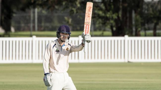 Kendel Fleming raising the bat as a youngster. Photo: Ian Bartlett,