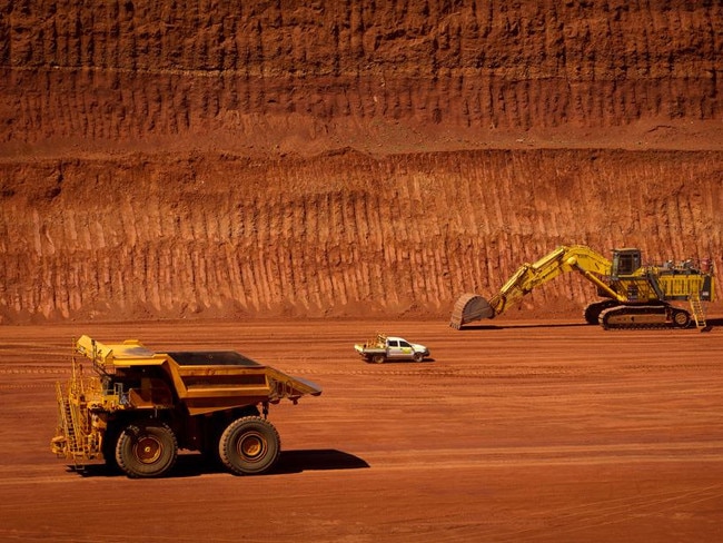 FILE PHOTO: Machinery operates in a pit at Rio Tinto Group's West Angelas iron ore mine in Pilbara, Australia, on Sunday, Feb. 19, 2012. Rio Tinto Group said Chief Executive Officer Tom Albanese will step down, after announcing a surprise $14 billion impairment. Sam Walsh, head of the iron-ore division, has been appointed as his successor with effect from today, the company said in a statement. Photographer: Ian Waldie/Bloomberg via Getty Images