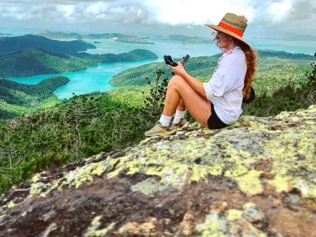 Taking in the view at Whitsunday Peak. Picture: Jam Press