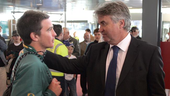 With then-Socceroos coach Guus Hiddink at Rotterdam airport in 2006 after Musialik trained with the team ahead of the World Cup in Germany. 