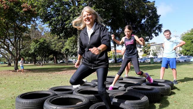 Deputy Mayor Donna Gates challenging young Gold Coasters to an obstacle course race, with Sophie Taylor of Coombabah, age 11. Picture Mike Batterham