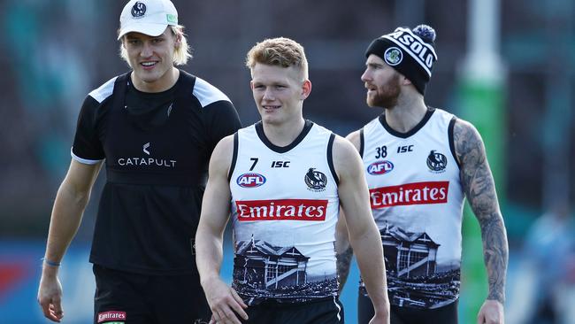 Injured Collingwood trio (from left) Darcy Moore, Adam Treloar and Jeremy Howe.