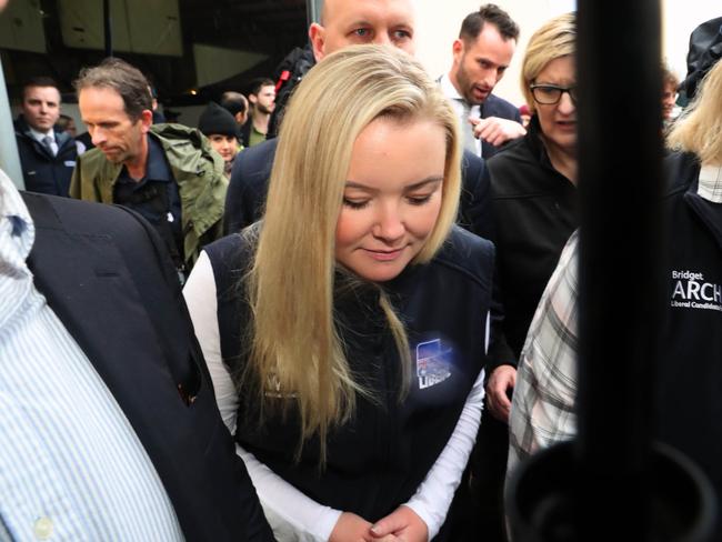 Jessica Whelan is rushed away from the media during a tour of Agfest on Thursday. Picture: GARY RAMAGE