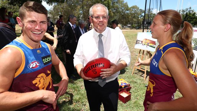 Prime Minister Scott Morrison talks with Dayne Zorko and Kate Lutkins.