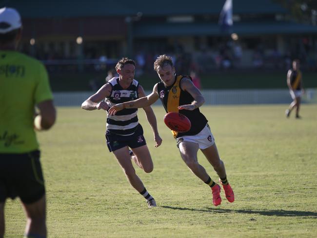 Pictured (l-r): Crocs winger Josh Lea and Tigers speedster James Neale. Port Douglas Crocs v North Cairns Tigers at Port Douglas Sporting Complex. AFL Cairns 2024. Photo: Gyan-Reece Rocha