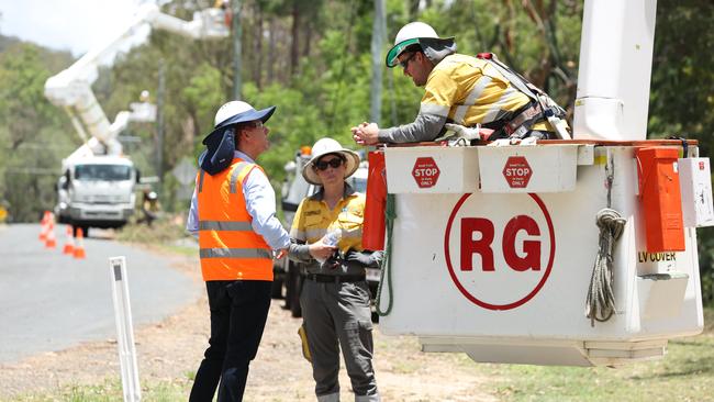 Deputy Premier Cameron Dick with Energex workers at Tamborine on Sunday. Picture: Lachie Millard