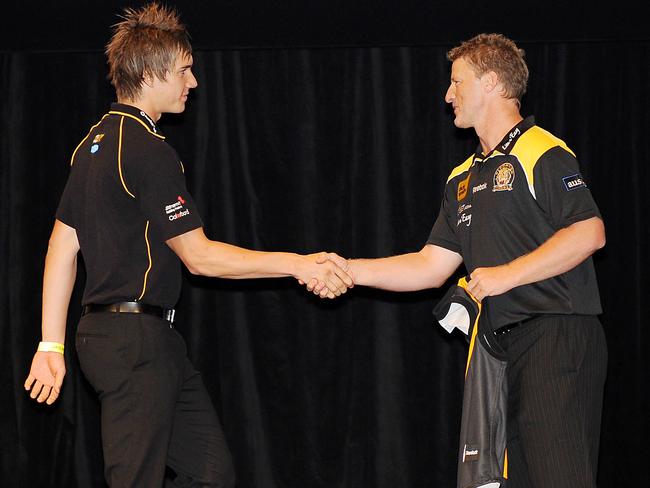 Damien Hardwick presents Dustin Martin with his Richmond jumper at the 2009 draft. Picture: George Salpigtidis