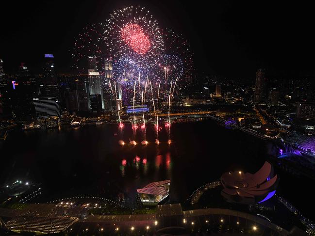 Fireworks burst over the water of Marina Bay during the New Year countdown celebration in Singapore on January 1, 2019. Picture: AFP