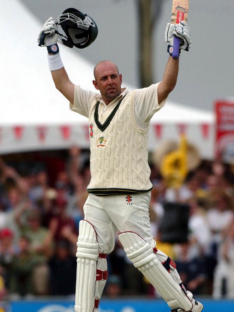 Cairns, July 26, 2003. Australian batsman Darren Lehmann celebrates scoring a century on the 2nd day of play at Cazaly's Sport Ground during the second Australia v Bangladesh Top End Tour test cricket in Cairns. It is the first time a test match has been played in Cairns. (AAP Image/Julian Smith)