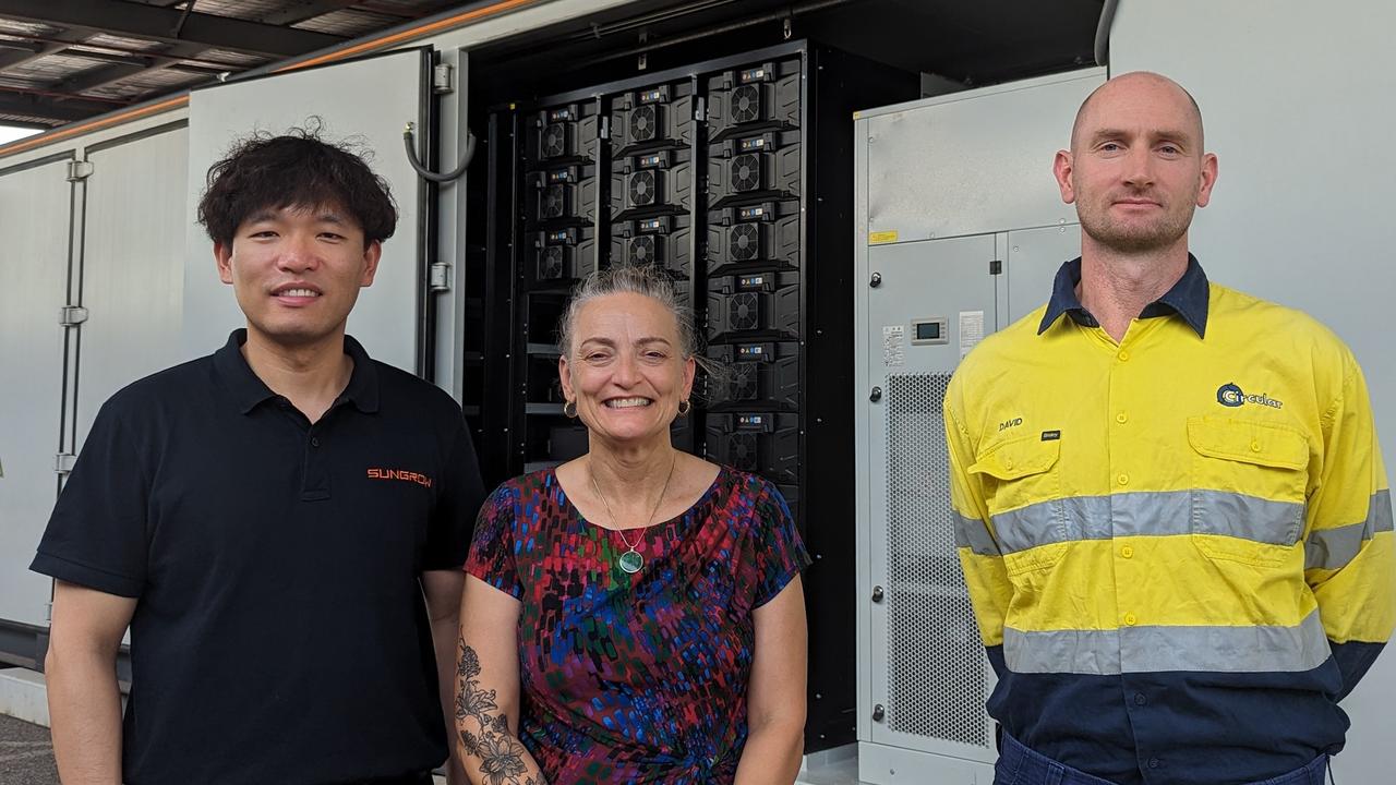 Battery manufacturer Sungrow's Simon Du, Renewables Minister Kate Worden and Circular Solutions managing director David Dennis in front of the 1.75MVA battery that will shortly make its way to Wurrumiyanga. Picture: Alex Treacy