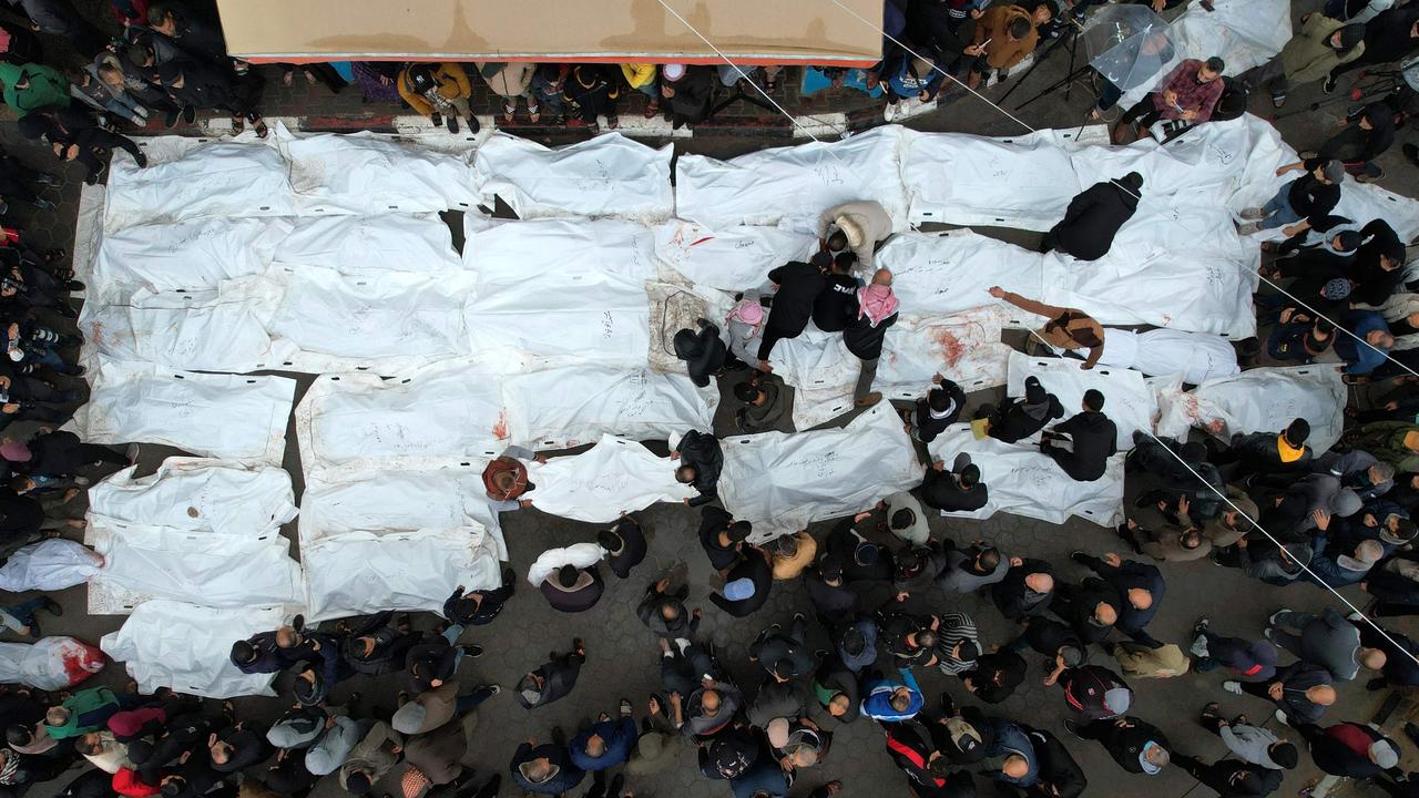 An aerial view shows Palestinians mourning their relatives, killed in an overnight Israeli strike on a refugee camp, during a mass funeral at the Al-Aqsa hospital. Picture: AFP