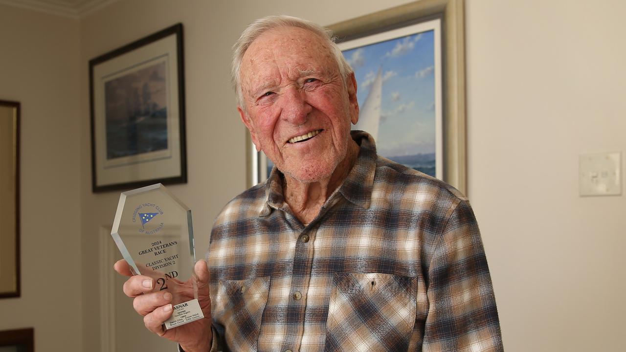 Gordon Ingate at his Sydney home last year with one of a multitude of trophies he has won over the years.