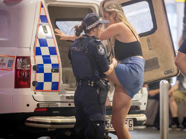 SCHOOLIES - SURFERS PARADISE 2016. Victorian Schoolies flock to Surfers Paradise to celebrate high school graduation. A woman is taken into police custody. Picture: Jake Nowakowski