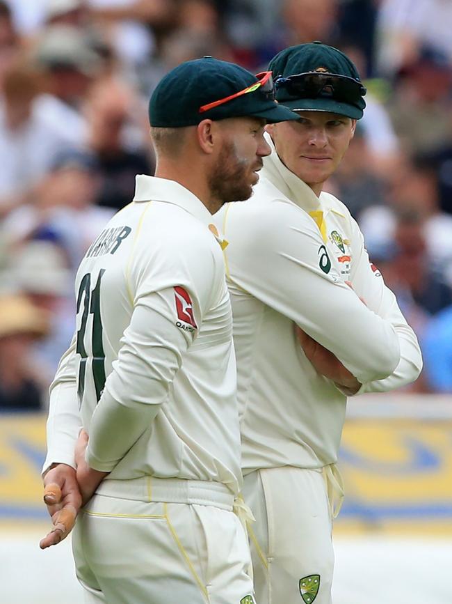 Tim Paine has made it clear he’ll seek counsel of the former leadership team of David Warner, left, and Steve Smith. Picture: AFP