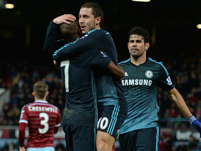 Chelsea's Belgian midfielder Eden Hazard (2nd R)) celebrates with Chelsea's Brazilian midfielder Ramires after scoring the opening goal of the English Premier League football match between West Ham United and Chelsea at the Boleyn Ground in Upton Park, East London on March 4, 2015. AFP PHOTO / GLYN KIRK RESTRICTED TO EDITORIAL USE. NO USE WITH UNAUTHORIZED AUDIO, VIDEO, DATA, FIXTURE LISTS, CLUB/LEAGUE LOGOS OR "LIVE" SERVICES. ONLINE IN-MATCH USE LIMITED TO 45 IMAGES, NO VIDEO EMULATION. NO USE IN BETTING, GAMES OR SINGLE CLUB/LEAGUE/PLAYER PUBLICATIONS.