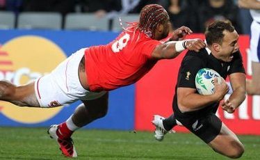 All Black fullback Israel Dagg eludes Tonga halfback Taniela Moa to score during last night's World Cup opener at Eden Park. Picture: Paul Estcourt, NZ Herald