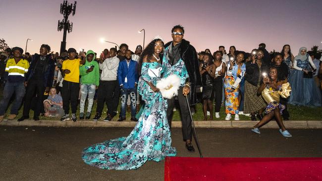 Irenne Kininga and Jacques Nikodemu Ntambwe arrive at Harristown State High School formal at Highfields Cultural Centre, Friday, November 18, 2022. Picture: Kevin Farmer