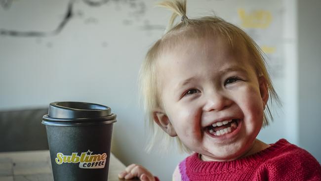 Bethany, 2, is pretty happy to hear the news her dad’s cafe Sublime Coffee Roasters was voted the best coffee in the west. Picture: AAP/Roy VanDerVegt