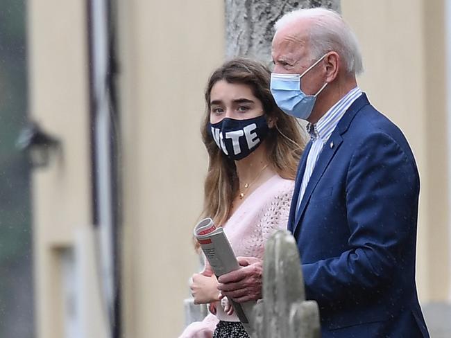 Democratic presidential nominee and former Vice President Joe Biden leaves church with his granddaughter Finnegan Biden. Picture: AFP