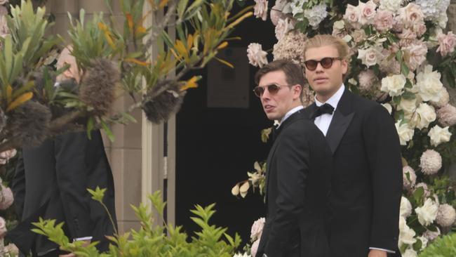 Jake Thrupp (right) and other guests arrive at Paula Pratt wedding.