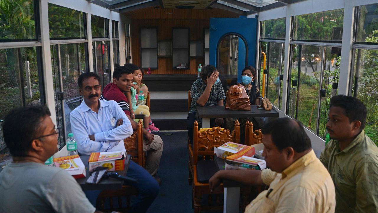 Tourism returns. Tourists travel in a coach of the Jungle Tea Safari service of Darjeeling Himalayan Railway's (DHR) narrow gauge locomotive, also known as the 'Toy Train' after the service resumed that was earlier suspended in the wake of the pandemic. Picture: Diptendu Dutta / AFP