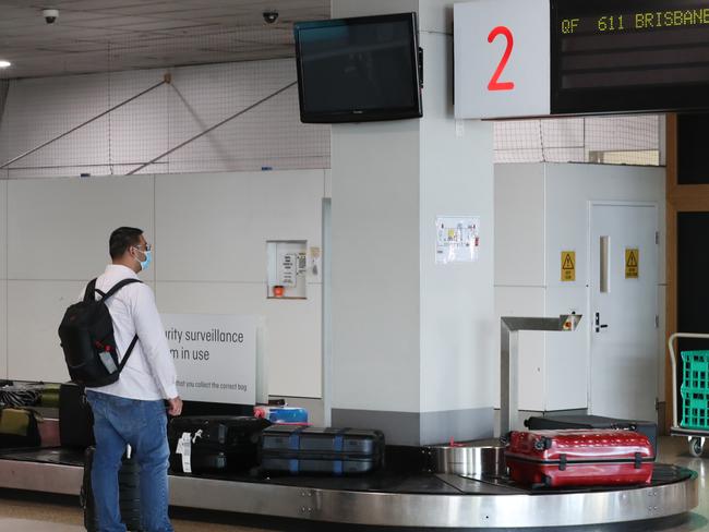 A passenger arrives at Melbourne Airport from a Brisbane flight where a COVID lockdown is underway in Brisbane. Saturday, January 9, 2021. Picture: David Crosling