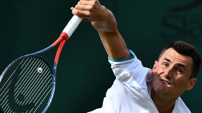 Australia's Bernard Tomic serves against France's Jo-Wilfried Tsonga. Picture: AFP