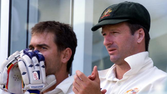 Former Test teammates Justin Langer (left) and Steve Waugh watch on from the sidelines against Pakistan at the Gabba in 1999.