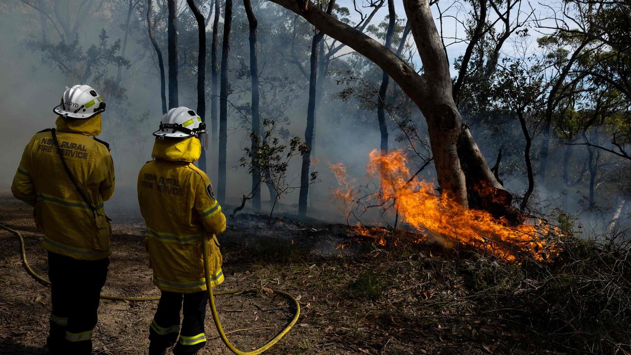 Volunteer firefighters monitor a hazard reduction burn in North Sydney as they prepare for what they predict could be the fiercest fire season since 2019-2020. Picture: Aston Brown / AFP