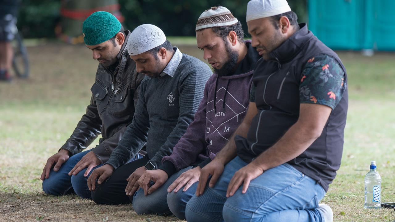 Muslim worshippers pray in Hagley Park near the Al Noor mosque on Deans Rd in Christchurch, New Zealand. Picture: AAP/SNPA, David Alexander.
