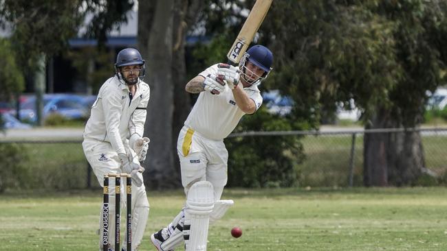 Buckley Ridges keeper Troy Aust watches on as Narre South batsman Kyle Hardy clips through mid-wicket. Picture: Valeriu Campan