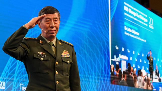 China's Minister of National Defence Li Shangfu salutes the audience before delivering a speech on Sunday. Picture: AFP