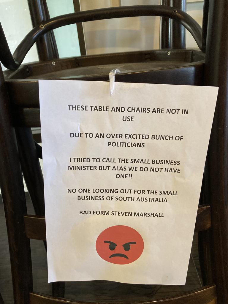 Sign on stacked tables and chairs protesting at Covid-19 restrictions in Del Giorno's Cafe Restaurant in Port Lincoln on January 12, 2022. Picture: Paul Starick.