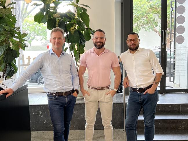 Mark Foy, director of McGrath Surry Hills (in blue shirt) with sales agents Wes Smuts (pink shirt) and Dave Ashby (white shirt) - for Careers