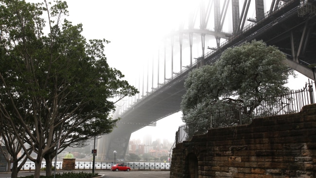 Sydney Harbour, the Harbour Bridge the Opera House and surrounding buildings in early morning fog. Photo by Steve Christo/Corbis via Getty Images